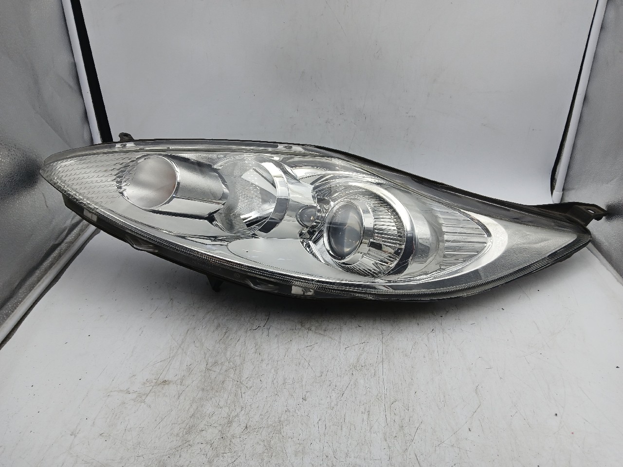 Faro ant sx FORD FIESTA